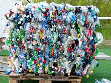 Wooden pallet containing a bale of recycled plasic bottles